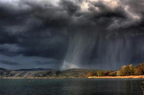 Rainstorm | Ocean landscape, Rain pictures, Lightning photography