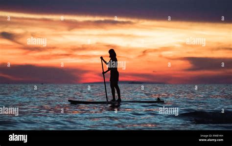 Woman Paddleboarder on Beach Sunset - Boracay Island, Panay - Philippines Stock Photo - Alamy