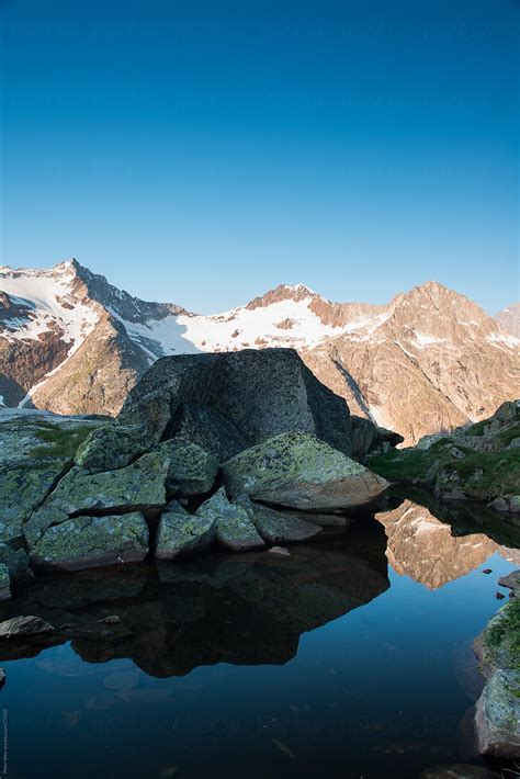 "Mountain Lake At Sunrise" by Stocksy Contributor "Peter Wey" - Stocksy