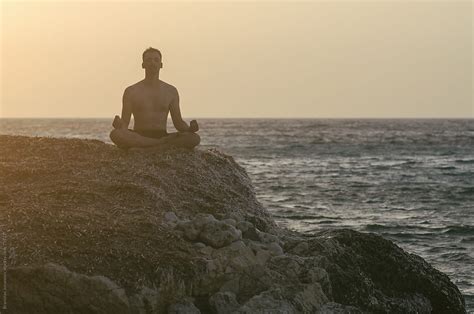 "Man Meditating At The Beach" by Stocksy Contributor "Brkati Krokodil ...