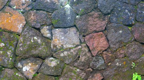 a mossy stone wall as a background 15744267 Stock Photo at Vecteezy