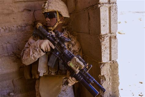 Marine providing security during a military operations in urban terrain ...