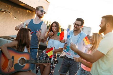 Group of People Holding National Flags on Rooftop Stock Image - Image of diversity, drink: 128477457