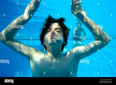 two young boys diving at an open air bath Stock Photo - Alamy