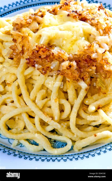 German cheese noodles called spaetzle Stock Photo - Alamy