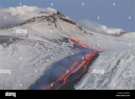 Volcano Eruption with snow Stock Photo - Alamy