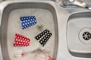 Free Image of Washing Colored Cups in the Sink with Bubbles | Freebie.Photography