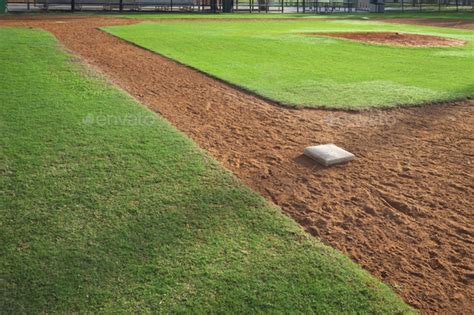 Baseball field from first base side in morning light Stock Photo by DanThornberg