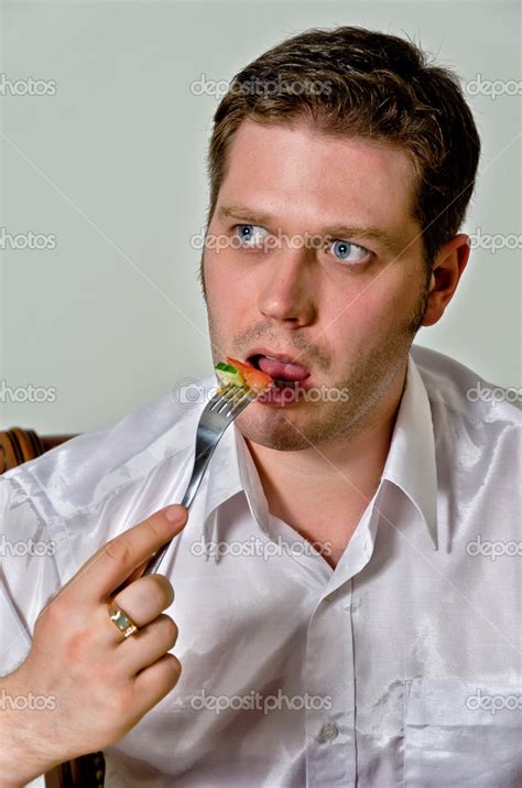 Handsome man eating salad. Close up — Stock Photo © dmitrimaruta #12438936