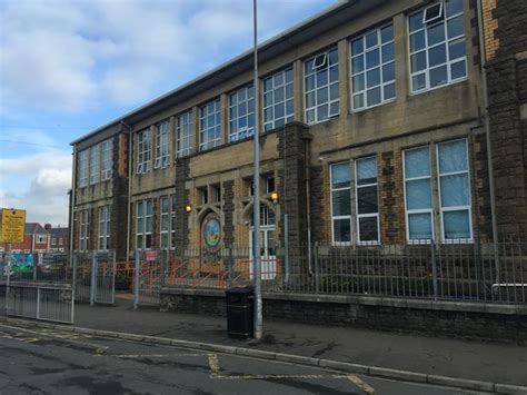 Children are having to sit on soggy floors in leaky classrooms at a Cardiff primary school ...