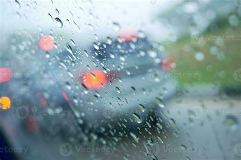 Rain drops on car window , rainy day 24200461 Stock Photo at Vecteezy