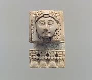 Furniture plaque carved in relief with a “woman at the window” | Assyrian | Neo-Assyrian | The Met