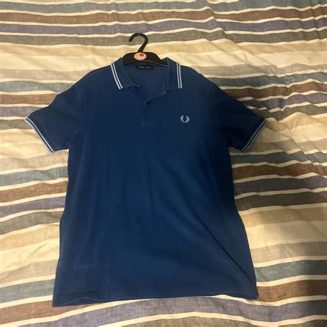 Fred Perry blue polo shirt Size medium Very good... - Depop