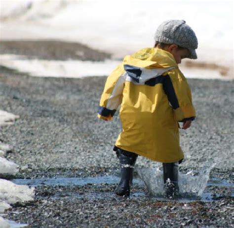 boy splashing in rain puddle | Kids learning, Rainy day activities ...