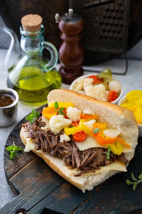 Assembled italian beef sandwich topped with giardiniera | Italian beef ...