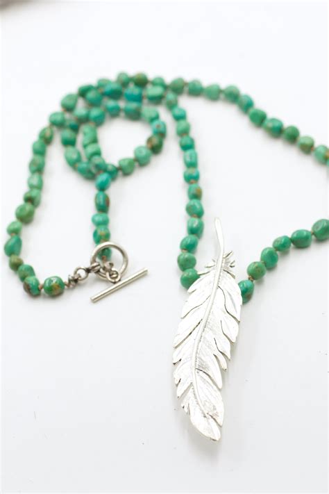 Sterling silver engraved feather pendant on turquoise necklace