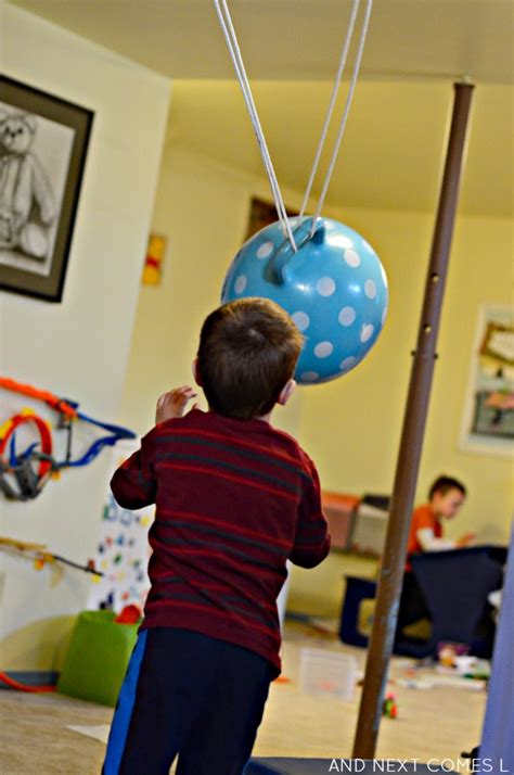 DIY Ball Swing {Sensory Hack for Kids} | And Next Comes L