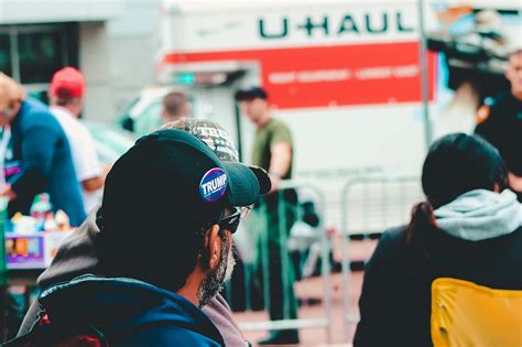 Selective Focus Photography of Man Wearing Black Cap · Free Stock Photo