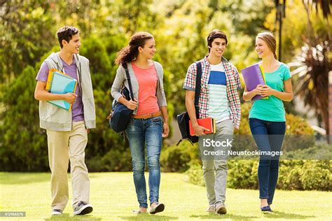 Happy College Students Walking On Campus Stock Photo - Download Image ...