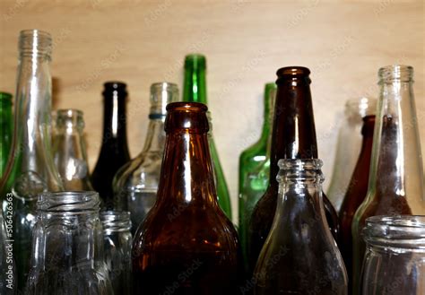 Glass waste for recycle. Empty glass bottles from beer wine and champagne. Ecology and ...