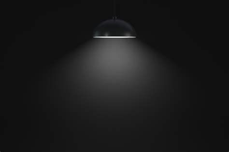 Premium Photo | Hanging lamp glows in a dark room copy space design element