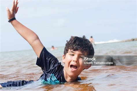 Boy Swimming Stock Photo - Download Image Now - Beach, Beach Holiday, Boys - iStock