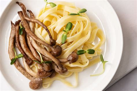 Close-up of Cooked Shimeji and Noodles, Plate with Fried Mushrooms and ...