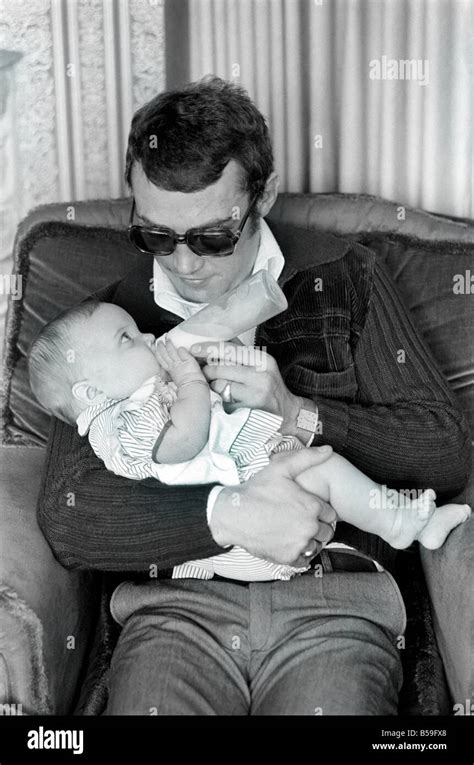 Boxer Alan Minter pictured at his Crawley Sussex home with his six month old baby daughter Kerry ...