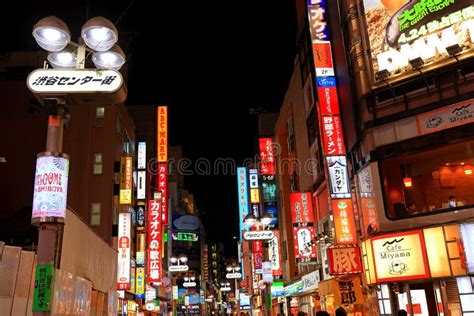 Night Night View with Neon Signs and Illuminated Billboards in Downtown ...