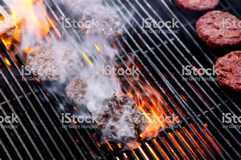 Grilling beef burger at home - Royalty-free American Culture Stock Photo Barbecue Recipes ...