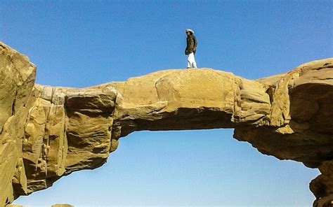 Hiking up Burdah rock bridge - Wadi Rum Nomads