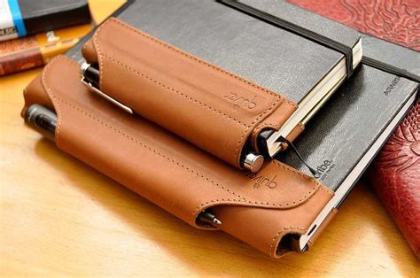 The Quiver pen holder for Moleskine notebooks. | Leather projects, Leather notebook, Leather books