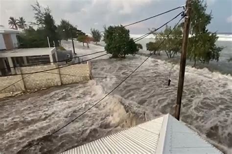 A tsunami caused by the eruption of a volcano hits the island of Tonga