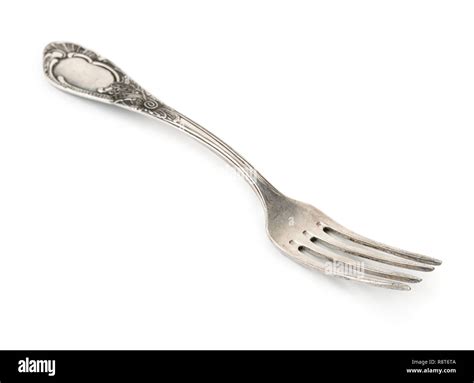 Old silver fork isolated on white Stock Photo - Alamy