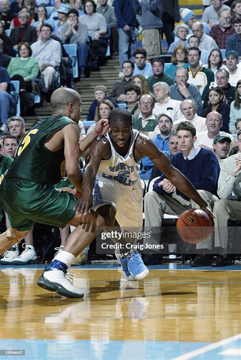 Raymond Felton of the UNC Tar Heels drives against Andre Anderson of ...