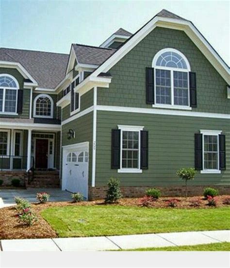 I'm painting our house this color with black shutters. | Green house exterior, Green exterior ...