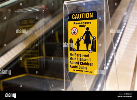 Escalator safety label Stock Photo - Alamy