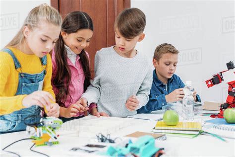 Focused children working together on stem project in classroom - Stock ...