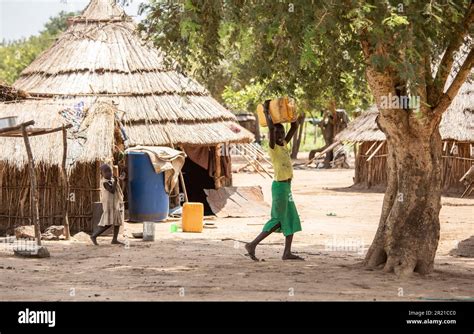 Torit, South Sudan- August 18, 2021: Unidentified children carry water ...