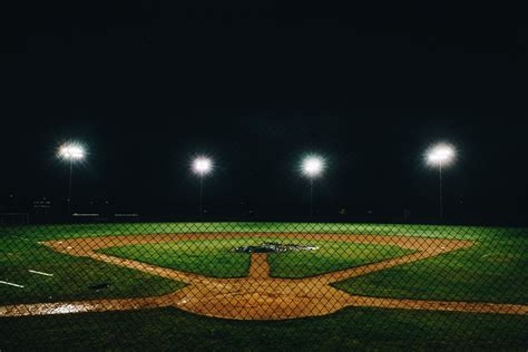 Baseball diamond lit at night