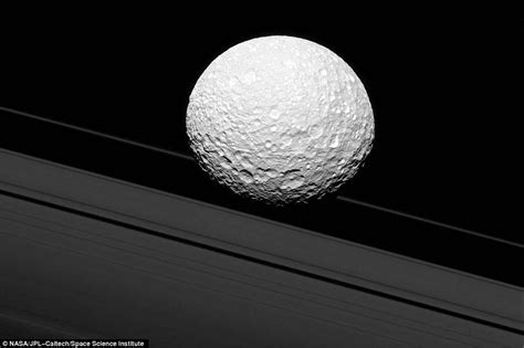 Cassini image appears to show Saturn's moon Mimas crashing into its ...