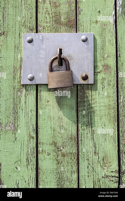 Old key lock on wooden door Stock Photo - Alamy