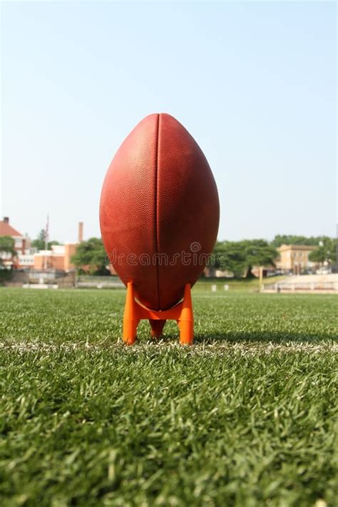 Football on a kicking tee stock image. Image of leather - 28907409