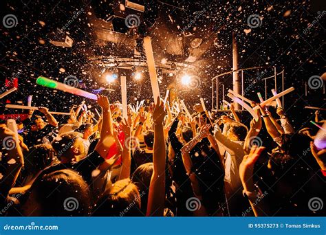 Nightclub crowd dancing editorial stock photo. Image of hand - 95375273