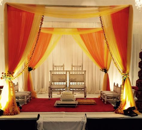 Red & Gold Fabric Mandap with Marigold Flowers by Aayojan Decorators of ...