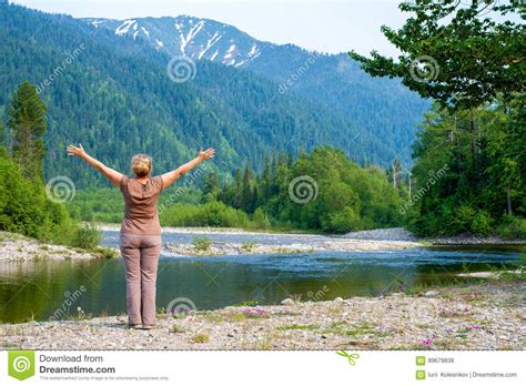 Woman Enjoying the Views of the Snezhnaya Snowy River, Forest and Mountains Stock Photo - Image ...