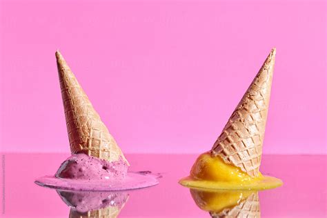 "Fruit Melting Ice Cream With Wafer Cones Reflected On A Pink Glossy ...