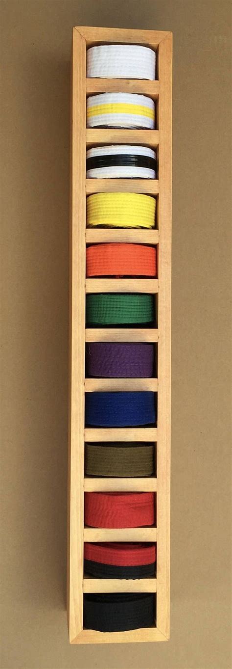 Display martial arts belts artfully with this solid wood display. It is a great way to recogni ...