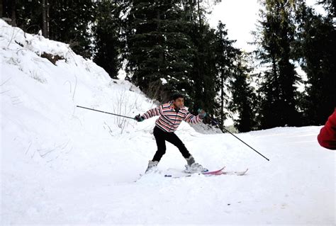 A boy enjoys skiing in Himachal