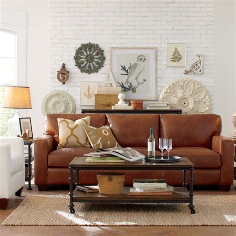 A traditional living room with wall art accents Couches Living Room, Farm House Living Room ...